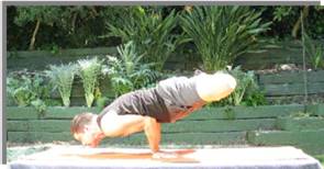 Yogi Marcos in Mayurasana with loto legs posture